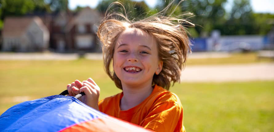 A child playing outside at camp