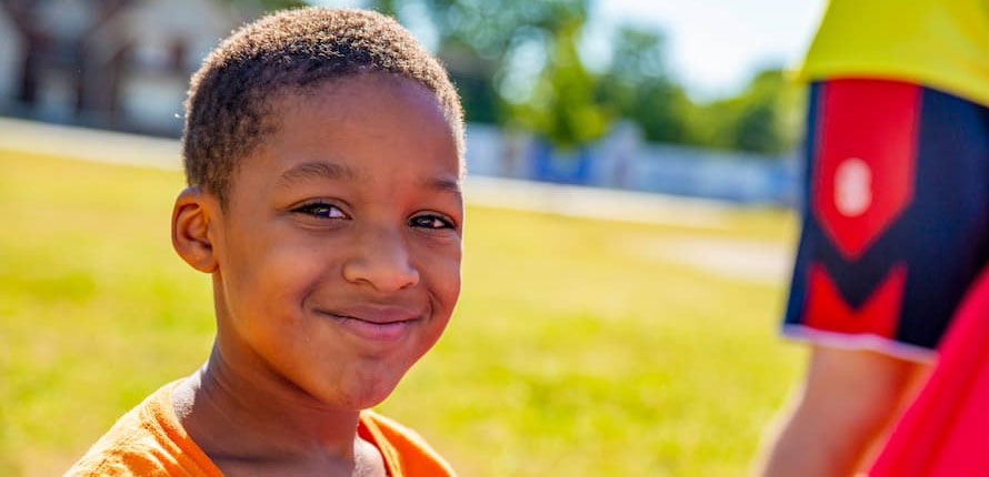 A camp participant smiling